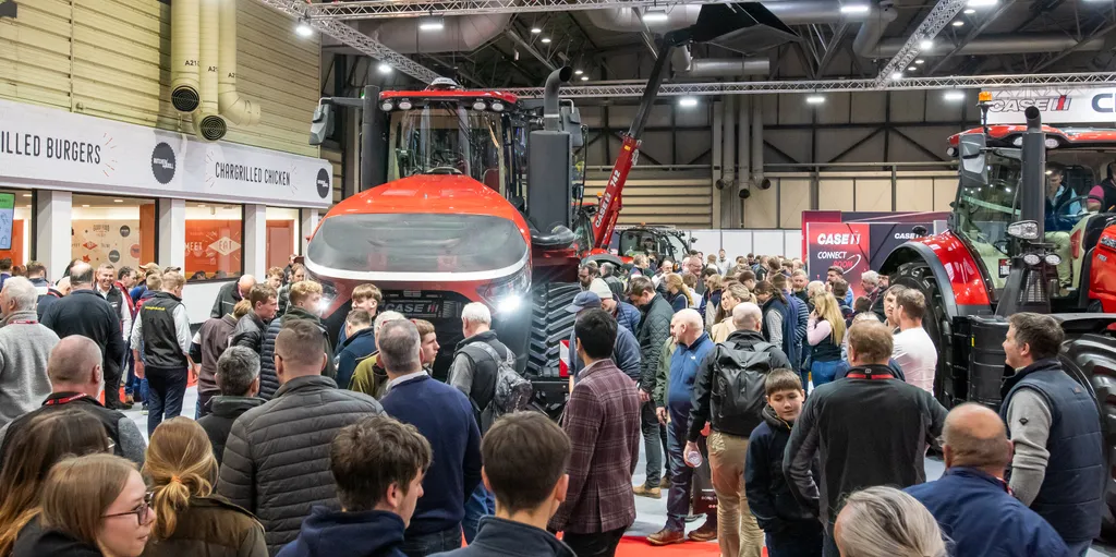 Image of the LAMMA event, with attendees gathered around exhibits.