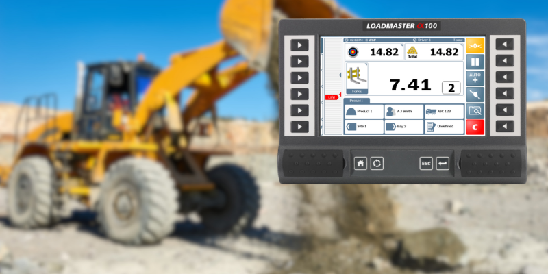 Loadmaster Alpha 100 superimposed on an image of a yellow wheel loader, compatible with Sitelink3D v2.